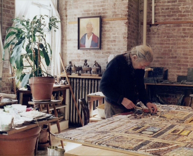 Edith Kramer assembling a mosaic in her studio